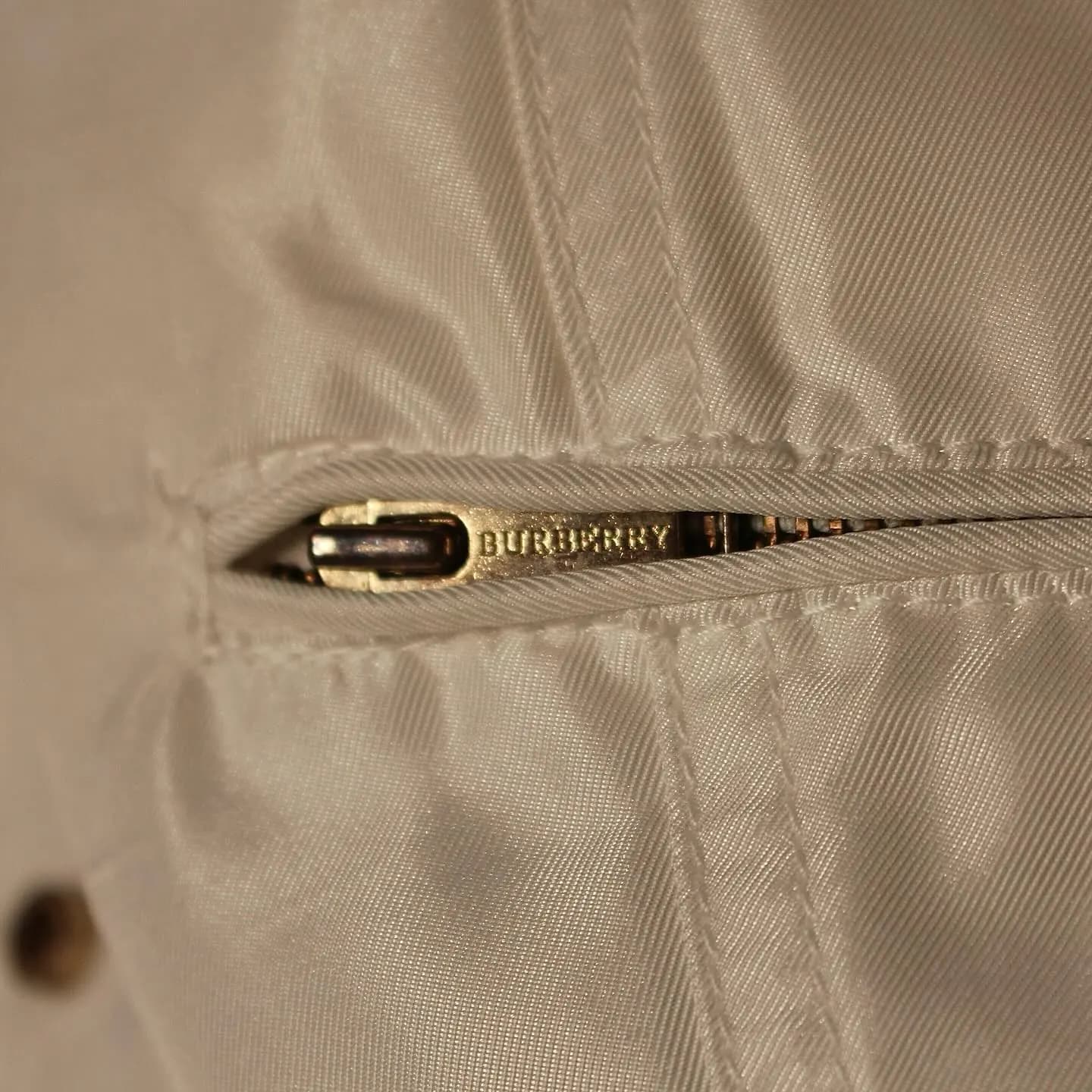 White Burberry women’s zippered down jacket, belted waist, view 4 of 11